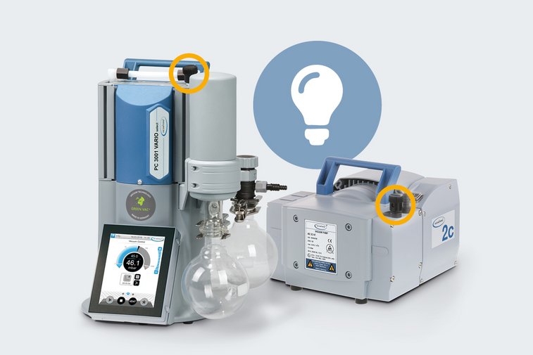 Vacuum pump models PC 3001 VARIO select and MZ 2C NT on a grey background. The integrated gas ballast is highlighted with a yellow circle for better visualization.