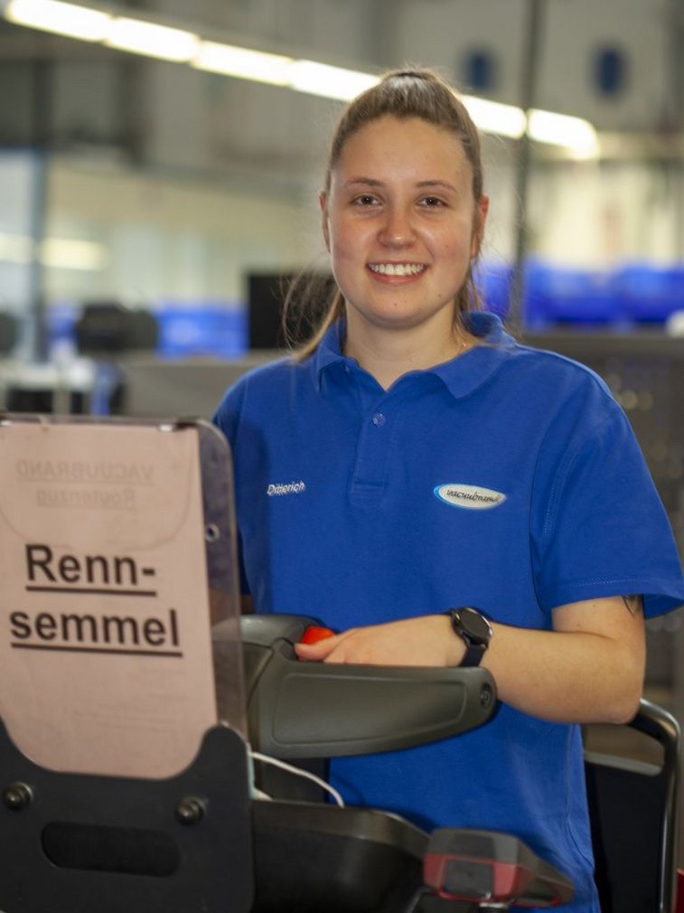 Lena Ditterich, Warehouse Logistics Specialist at VACUUBRAND, riding our milk run train, also called “Racing Bun”.